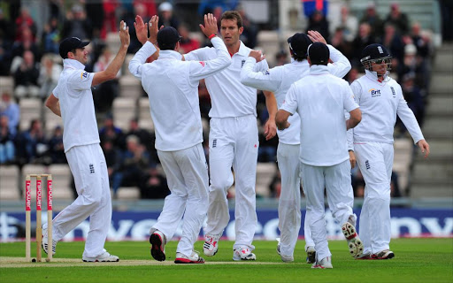 England bowler Chris Tremlett (c) celebrates with team mates after taking the wicket of Sri Lanka batsman Thisara Perera during day two of the 3rd test between England and Sri Lanka at the Rosebowl on June 17, 2011 in Southampton, England