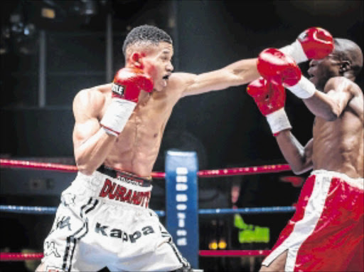 POWER SHOT: Lodumo Lamali, left, en route to a first round knockout win against Ephraim Chauke. Lamali is the twinkle-toed boxing star from the Nick Durandt stablePHOTO: n-squared