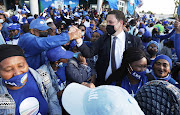 DA Cape Town mayoral candidate Geordin Hill-Lewis celebrates with supporters in Athlone on the Cape Flats.
