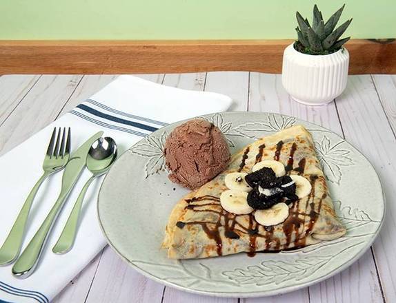 Choco Crepe: A heavenly blend of Nutella, ripe bananas, and Oreo biscuits, crowned with a scoop of luscious chocolate ice cream, all drizzled with decadent chocolate syrup. Pure delight!