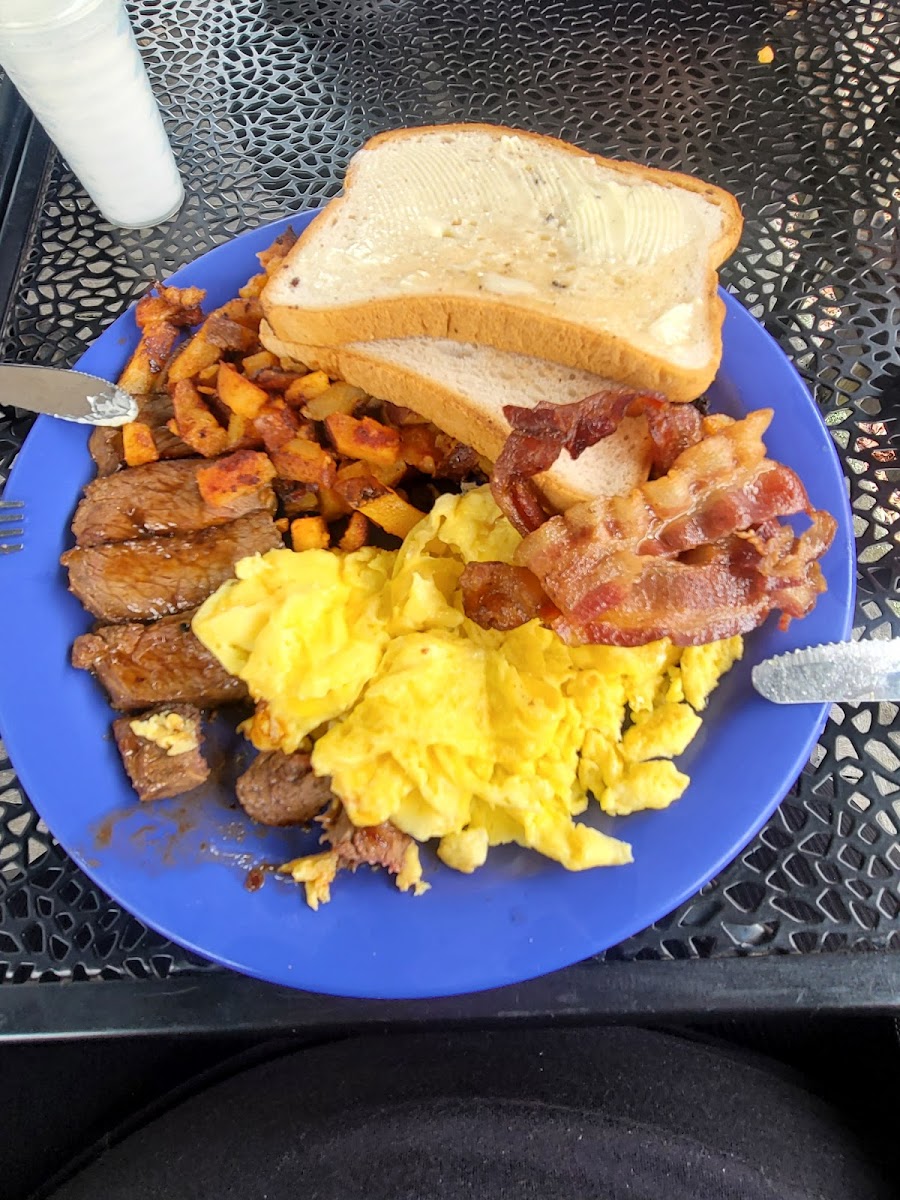 Steak and eggs with home fries and bacon and GF toast