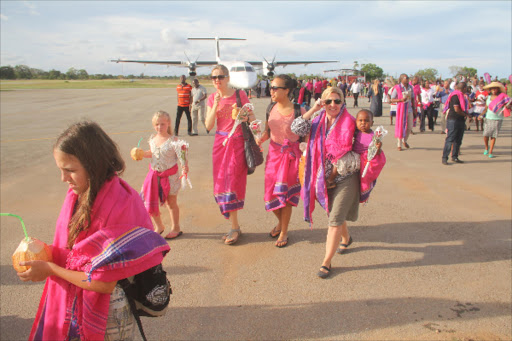 Tourists arrive at Diani airstrip.