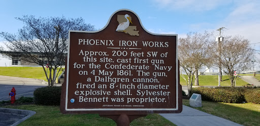 Approx. 200 feet SW of this site, cast first gun for the Confederate Navy on 4 May 1861. The gun, a Dalhgren cannon, fired an 8~inch diameter explosive shell. Sylvester Bennett was proprietor.
