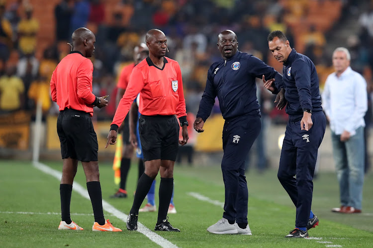 SuperSport United head coach Kaitano Tembo and goalkeeper coach Andre Arendse protest to match officials.