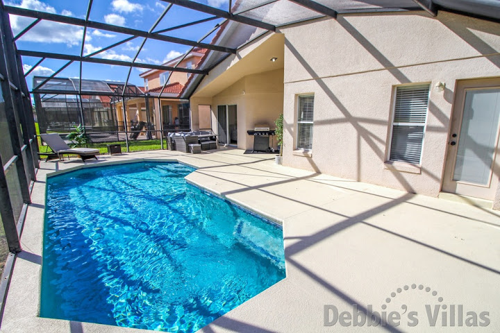 Plenty of space on the sun-drenched pool deck of this Davenport vacation villa