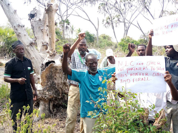 Residents protest forest lands grabbing in Kwale on Saturday, October 2021.