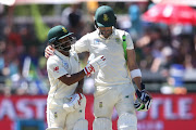 Temba Bavuma of South Africa and South African captain Faf du Plessis congratulate each other for reaching tea during day 2 of the 2nd Castle Lager Test match between South Africa and Pakistan at PPC Newlands on January 04, 2019 in Cape Town, South Africa. 