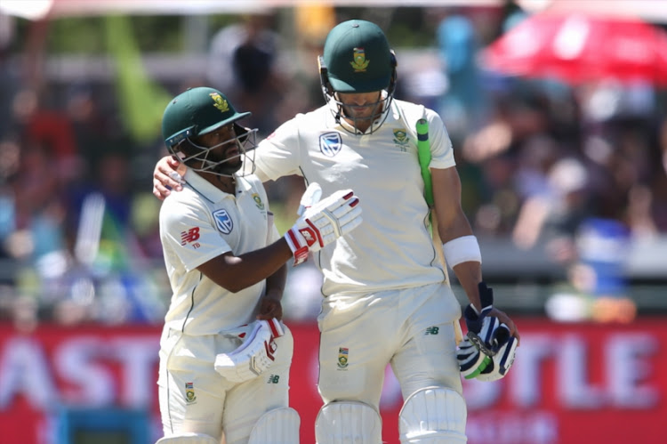 Temba Bavuma of South Africa and South African captain Faf du Plessis congratulate each other for reaching tea during day 2 of the 2nd Castle Lager Test match between South Africa and Pakistan at PPC Newlands on January 04, 2019 in Cape Town, South Africa.