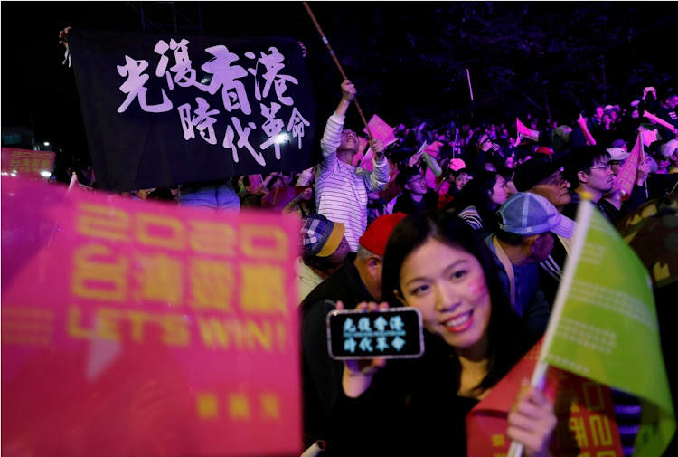 Hong Kong anti-government protesters attend a rally in support of Taiwan President Tsai Ing-wen outside the Democratic Progressive Party (DPP) headquarters in Taipei, Taiwan, on January 11 2020.