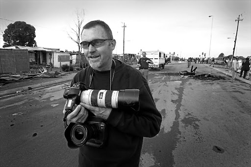 Jon Hrusa doing something he loved - taking photographs Picture: KIM LUDBROOK