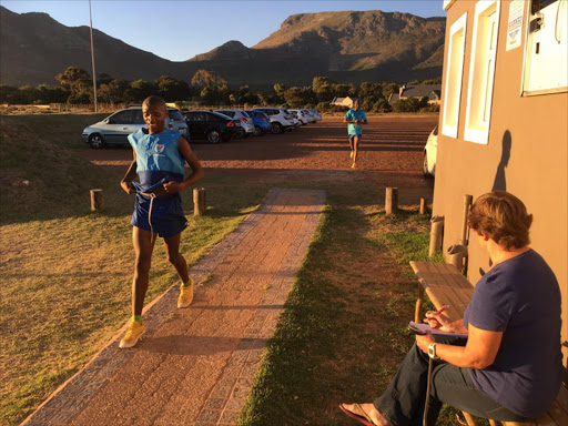 Inga Ngwenduana runs a time trial at Satori Athletics Club. Bridget Farham is in the foreground.