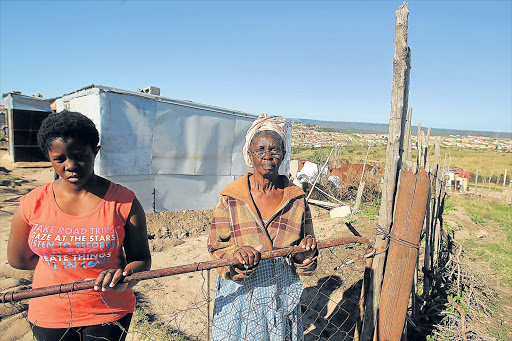SHACK SHOCK: NU18 residents Amanda Ntshongwe and her grandmother Nomfundo Ntshongwe have been told to remove their shacks so the contractor can start working Picture: SIBONGILE NGALWA