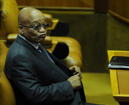 President Jacob Zuma listens as the Minster of Finance Nhlanhla Nene delivers his medium-term budget speech in the National Assembly on October 21, 2015 in Cape Town, South Africa.