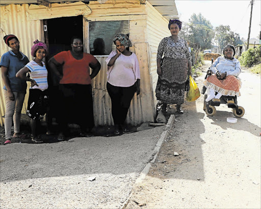 FORGET US NOT: A long power outage has left Nonthuthuzelo Mqokozo and her neighbours in misery Picture: BHONGO JACOB
