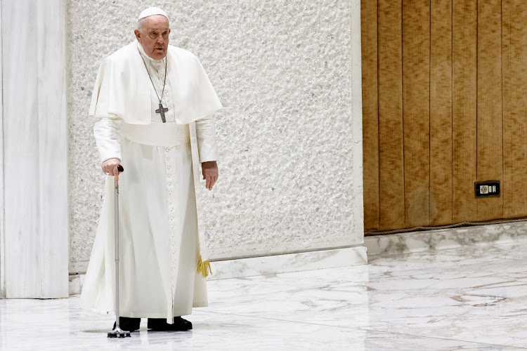 Pope Francis walks as he holds a weekly general audience, in Paul VI hall at the Vatican, January 24, 2024.