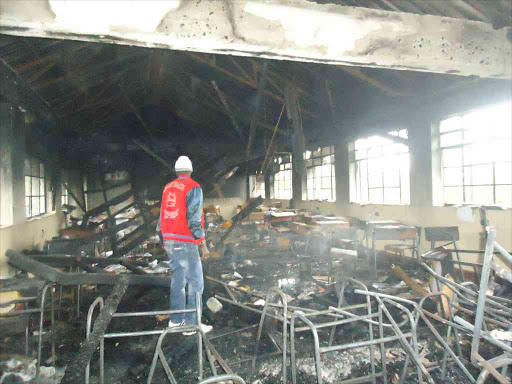 A parent inside a building burnt at Embu High School on July 17 2016. /FILE