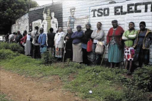 UNHEALTHY WAIT: A long line of patients at Meadowlands Clinic in Soweto waiting at 6am for the clinic to open PHOTO: MOHAU MOFOKENG