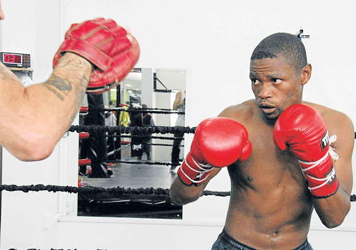 NEW CHAPTER: Former world champion Nkosinathi ‘Mabhere’ Joyi, seen here hard in training at the Bronx Gym in Johannesburg, has roped in former Boxing South Africa boss Loyiso Mtya as trainer after parting ways with Boy Boy Mpulampula Picture: BAFANA MAHLANGU