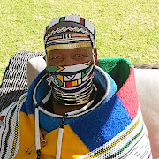Sophie Mahlangu wearing  her Ndebele mask.