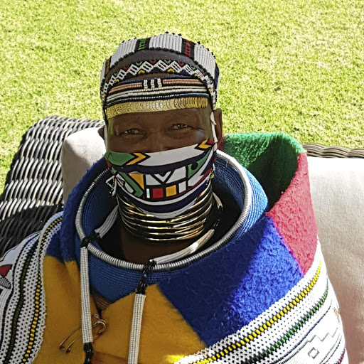 Sophie Mahlangu wearing her Ndebele mask.