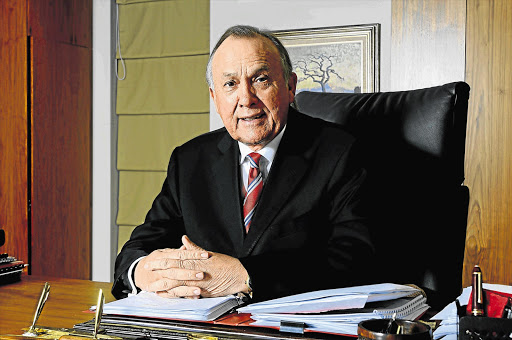 RED TAPE: Christo Wiese, chairman of Pepkor, at his desk in 2012