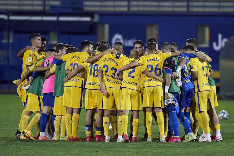 AD Alcorcon players huddle to celebrate the end of the season during the La Liga Smartbank match on July 20, 2020.