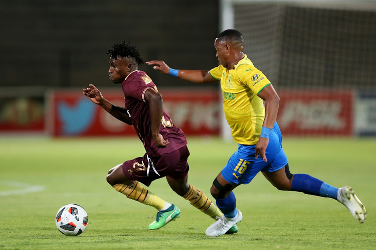 Stellenboch FC's Ibraheem Jabbar is challenged by Andile Jali of Mamelodi Sundowns in the DStv Premiership match at Danie Craven Stadium on December 4 2021.