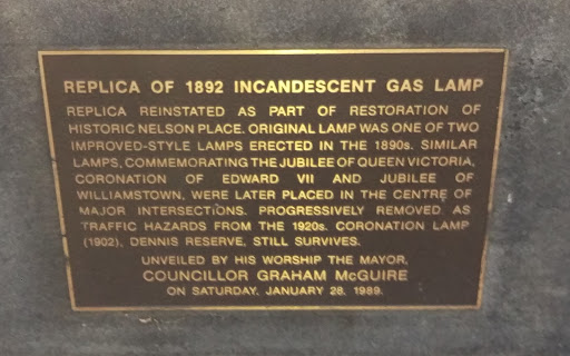 Plaque reads:'Replica of 1892 Incandescent Gas LampReplica reinstated as part of restoration of historic Nelson Place. Original lamp was one of two improved-style lamps erected in the 1890's....