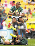 AIRBORNE: Cornal Hendricks of South Africa avoids an opponent during their game against the Cook Islands this month  in  New Zealand  Photo: Getty Images
