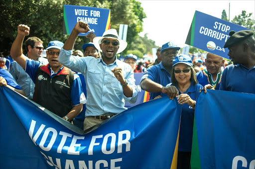 Democratic Alliance Leader Mmusi Maimane (L) and DA Cape Town mayor Patricia De Lille (R) lead thousands of South African main opposition party Democratic Alliance (DA) supporters marching to the Constitutional Court to protest against South African President Jacob Zuma. AFP Photo