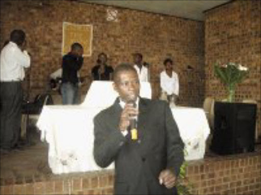 HOLY MAN: Pastor Lucky Petros Kubheka giving his acceptance speech after he was ordained as the second pastor of Christ The Rock Church in Daveyton at the weekend. Pic. Dan Fuphe. 03/02/08. © Sowetan.