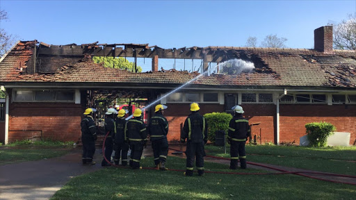 Firefighters extinguish the fire at the William O Brien Res at the University of KwaZulu-Natal campus in Pietermaritzburg on 26 September 2016.