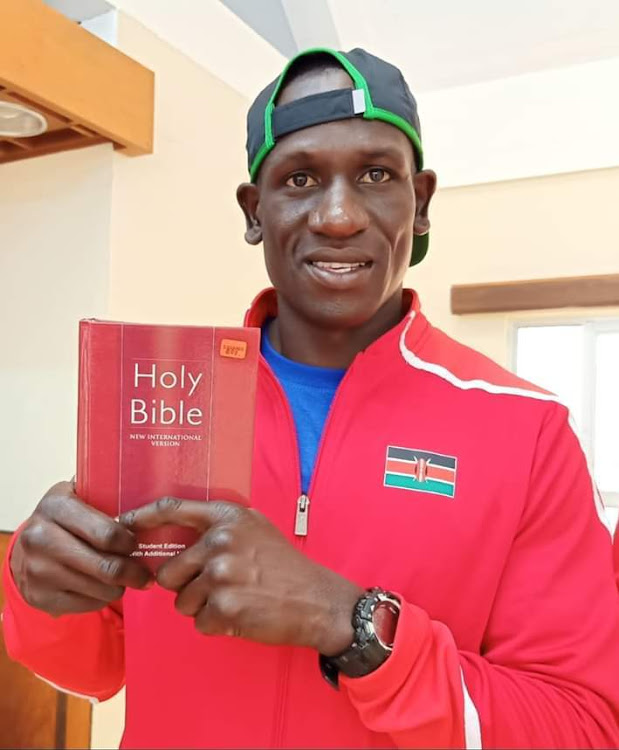 Edwin Okong'o displays a bible