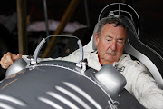 Pink Floyd drummer Nick Mason in an Auto Union Silver Arrow.