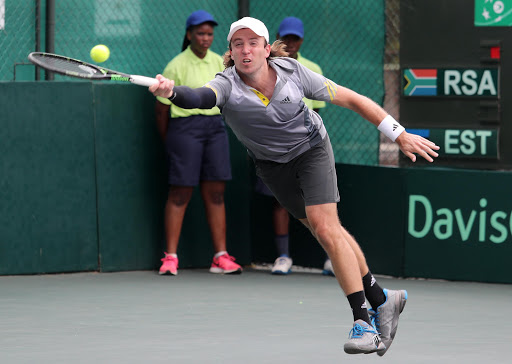 Vladimir Ivanov of Estonia in action against Nik Scholtz of South Africa during the reverse singles of the Davis Cup tie between South Africa and Estonia at the Irene Country Club on February 05 2017 in Pretoria, South Africa.
