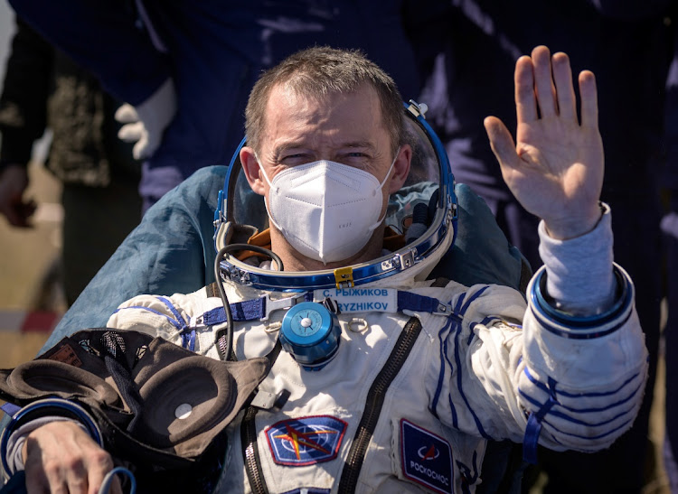 The International Space Station (ISS) crew member Sergey Ryzhikov of Roscosmos reacts after landing with the Soyuz MS-17 space capsule in a remote area outside Zhezkazgan, Kazakhstan April 17, 2021.