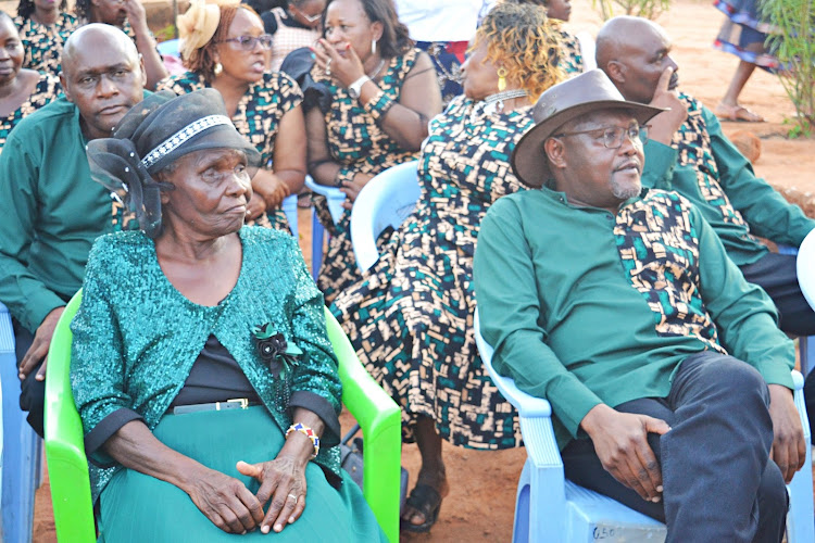Matriarch Lydia Kalekye and her son Paul Nzengu who is the MP for Mwingi North follow proceedings during the celebration on Saturday.