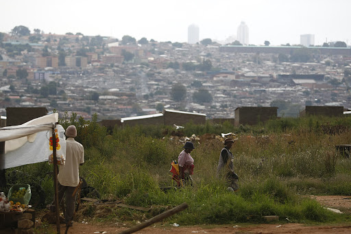 Sandton skyline seen from Alexandra township. The juxtaposition between the rich and the poor is especially evident in Alexandra, where some of South Africa's poorest live in the shadow of some of the country's richest.