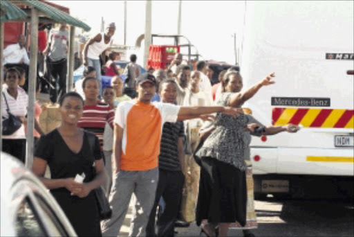 PANIC: Durban taxi commuters seek alternative transport after taxi operators started a two-day strike in protest against 'continued harassment' by metro police. Thousands of commuters, including schoolchildren, were left stranded due to the strike. Pic. Thuli Dlamini. 19/04/2010. © Sowetan.