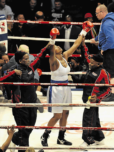 Noni Tenge celebrates after a successful defence of her title at Carnival City in June. She makes another defence in November Picture: LEFTY SHIVAMBU/GALLO IMAGES