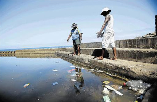 UNATTRACTIVE: JANUARY 04, 2015 Holiday makers complain about the state of the tidal pool at Gonubie where bottles, plastic packets and algae make it unsafe to swim in