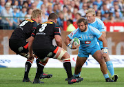 Pierre Schoeman of the Bulls is challenged by Pieter-Steph du Toit (5) and Wilco Louw (3) of the Stormers during the 2018 Super Rugby match at Loftus Versveld Stadium, Pretoria on 31 March 2018.