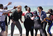 The Duke and Duchess of Sussex took part in activities with Waves for Change surfers at Monwabisi beach in Cape Town on September 24 2019.