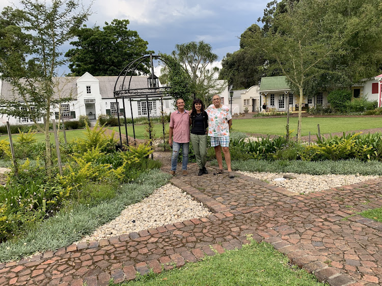 Tsitsikamma Village Inn owners, from left, Chris Sykes and his wife Irma de Villiers together with former owner Jan du Rand in the ‘village square’