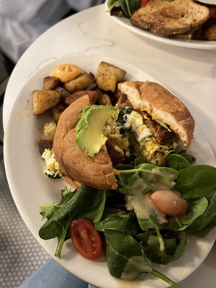 Plant-based egg and sausage sandwich on gluten free bagel