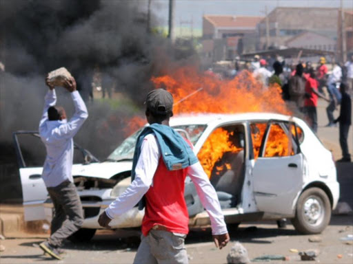 National Super Alliance supporters set a car on fire after the Supreme Court upheld the re-election of President Uhuru Kenyatta on Monday, November 20, 2017. /REUTERS