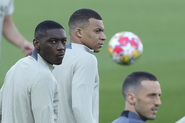 Paris St-Germain strikers Kylian Mbappe and Randal Kolo Muani during a training session at Barcelona's Lluis Companys Olympic Stadium facility on Monday.