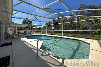 Sunny pool deck with conservation view at this Westridge vacation villa