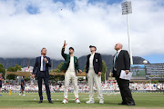 South African Captain Faf du Plessis tosses the coin as England captain Joe Root calls and Match referee Andy Pycroft during day 1 of the International Test Series 2019/20 game between South Africa and England at Newlands Cricket Ground, Cape Town on 3 January 2020.