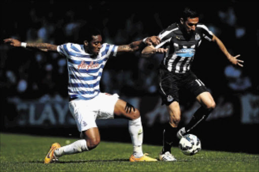 battle: Jonas Gutierrez of Newcastle United and Leroy Fer of QPR compete for the ball during their Premier League match on Saturday in London Photo: Clive Rose/Getty Images